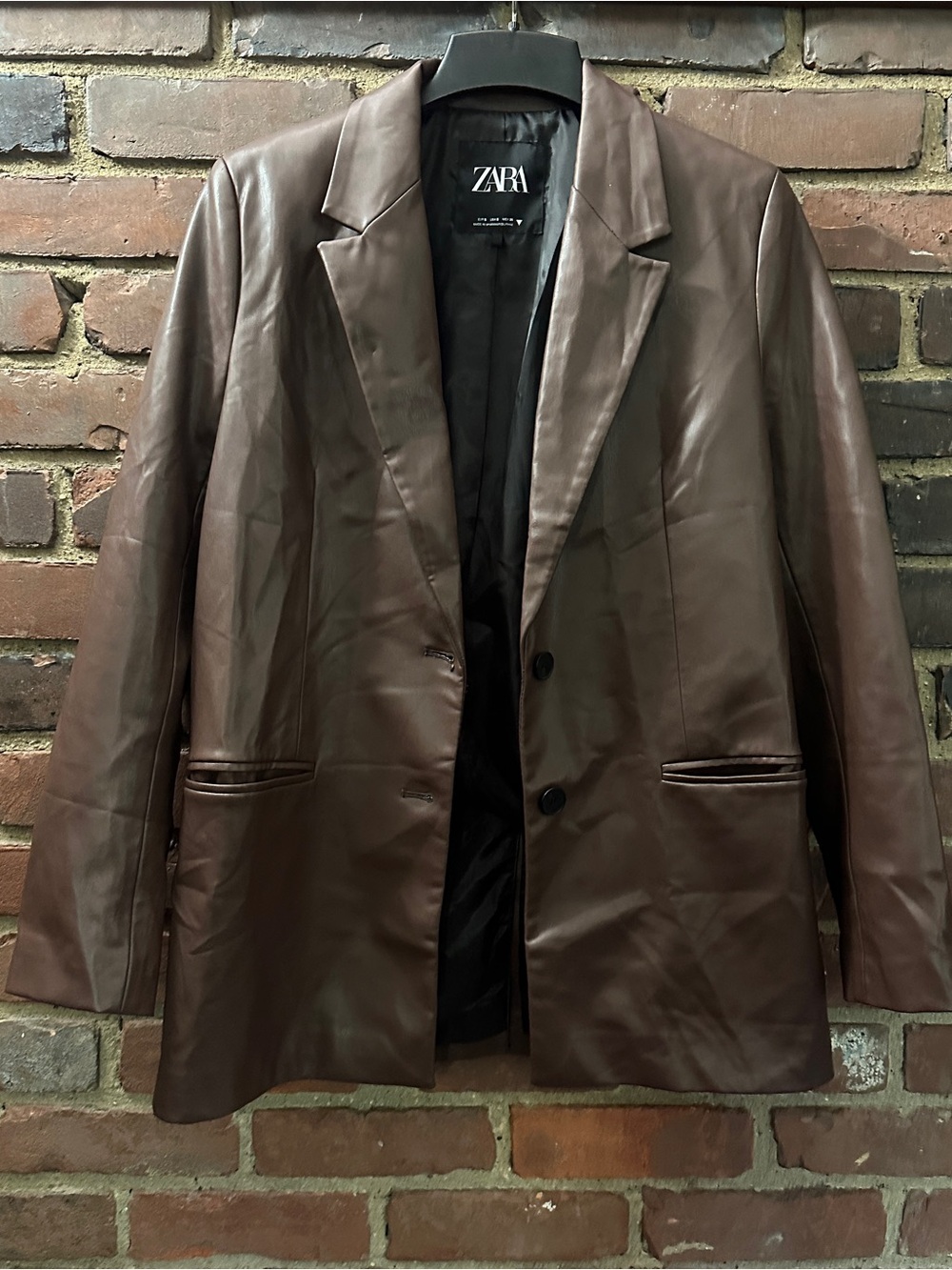 brown faux leather Zara blazer classic notch lapels and a front button closure